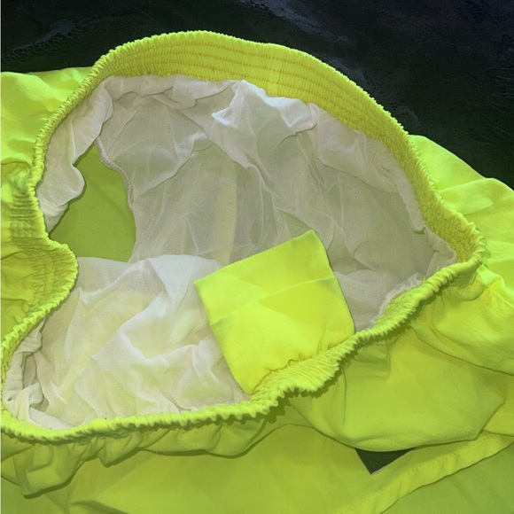 Tri-fit neon yellow shorts/ size large would fit best a medium or large - Picture 3 of 5